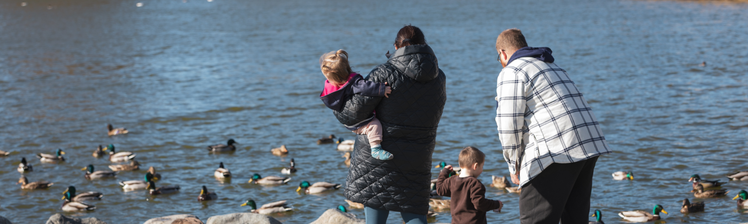 Family standing at Brydon Lagoon